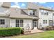 Rear exterior of home with screened-in porch and patio, surrounded by landscaping and grass at 9327 Falkwood Rd, Raleigh, NC 27617