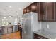 Modern kitchen with granite counters, stainless steel appliances, and open layout at 9327 Falkwood Rd, Raleigh, NC 27617