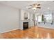 Spacious living room featuring hardwood floors, fireplace and open access to the kitchen at 9327 Falkwood Rd, Raleigh, NC 27617