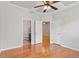 Main bedroom featuring tray ceilings, ceiling fan, and ensuite bathroom access at 9327 Falkwood Rd, Raleigh, NC 27617
