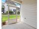 Screened patio offers an outdoor space with view of the backyard and neighboring property at 9327 Falkwood Rd, Raleigh, NC 27617