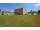 Spacious backyard with a lush lawn, ideal for outdoor entertaining and enjoying the natural surroundings at 935 Bombardier Ln, Spring Hope, NC 27882