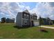 Charming two-story home with a two-car garage, nicely manicured lawn, and landscaping at 956 Bombardier Ln, Spring Hope, NC 27882