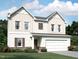 Charming two-story home with a two-car garage, complemented by beautiful landscaping at 956 Bombardier Ln, Spring Hope, NC 27882