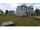 Two-story home featuring neutral siding, a two-car garage, and a well-manicured lawn at 956 Bombardier Ln, Spring Hope, NC 27882