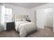 Bright bedroom features a window, neutral decor, and a closet for ample storage at 959 Bombardier Aly, Spring Hope, NC 27882