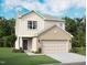 Charming two-story home with a brick-accented garage and well-maintained lawn at 959 Bombardier Aly, Spring Hope, NC 27882
