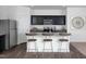 Modern kitchen features stainless steel appliances, granite countertops, and breakfast bar seating at 959 Bombardier Aly, Spring Hope, NC 27882