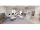 Bright living room with a sofa, open to the dining and kitchen, showcasing an open-concept design at 959 Bombardier Aly, Spring Hope, NC 27882