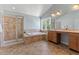 Bathroom featuring a vanity with double sinks, a tub, and a glass shower at 9603 Clubvalley Way, Raleigh, NC 27617