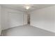 Neutral bedroom featuring large closet and a ceiling fan, carpeted floors at 9603 Clubvalley Way, Raleigh, NC 27617