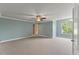 Spacious bedroom with neutral walls, carpet, ceiling fan, and natural light at 9603 Clubvalley Way, Raleigh, NC 27617