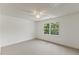 Bright bedroom featuring carpeted floors, window, and a ceiling fan at 9603 Clubvalley Way, Raleigh, NC 27617