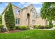Stunning brick home with lush landscaping, showcasing architectural details and a well-maintained lawn at 9603 Clubvalley Way, Raleigh, NC 27617