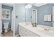 Well-lit bathroom showcases a dual sink vanity, a large mirror, and soft blue walls at 100 Wentbridge Rd, Cary, NC 27519