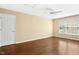Spacious bonus room with ceiling fan, hardwood floors and natural light from a large window at 100 Wentbridge Rd, Cary, NC 27519