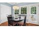 Cozy breakfast nook with a round table, natural light from windows, and access to the deck at 100 Wentbridge Rd, Cary, NC 27519