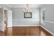 Formal dining area with chandelier, neutral paint, and hardwood flooring at 100 Wentbridge Rd, Cary, NC 27519