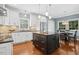 Well-equipped kitchen featuring white cabinets, granite countertops, stainless steel appliances, and a center island at 100 Wentbridge Rd, Cary, NC 27519