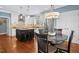 Updated kitchen featuring white cabinets, a central island, stainless steel appliances, and an eat-in area at 100 Wentbridge Rd, Cary, NC 27519