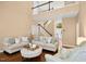 Spacious living room with hardwood floors, comfortable seating, and a view of the upper-level balcony at 100 Wentbridge Rd, Cary, NC 27519