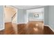 Inviting living room with beautiful hardwood floors and neutral paint at 100 Wentbridge Rd, Cary, NC 27519