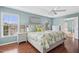 Main bedroom with a queen bed, bedside tables, hardwood floors, and natural light from the window at 100 Wentbridge Rd, Cary, NC 27519