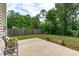 Outdoor patio with room for entertaining in a private, tree-lined backyard at 1024 Holland Bend Dr Dr, Cary, NC 27519