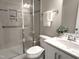 Updated bathroom featuring a glass shower enclosure, grab bar, and modern vanity at 1024 Holland Bend Dr Dr, Cary, NC 27519