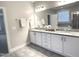 Bright bathroom with granite countertops, dual sinks, and a large mirror at 1024 Holland Bend Dr Dr, Cary, NC 27519
