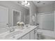 Bathroom featuring double sinks, sleek fixtures, and a shower-tub combination at 1024 Holland Bend Dr Dr, Cary, NC 27519