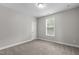 Bright bedroom with neutral walls, plush carpet, and a window offering natural light at 1024 Holland Bend Dr Dr, Cary, NC 27519
