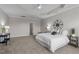 Spacious bedroom with tray ceilings, ceiling fan, and cozy carpet flooring at 1024 Holland Bend Dr Dr, Cary, NC 27519