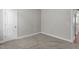 Cozy bedroom with plush carpet and a paneled door at 1024 Holland Bend Dr Dr, Cary, NC 27519