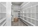Walk-in closet with built-in shelves and ample storage space, perfect for organization at 1024 Holland Bend Dr Dr, Cary, NC 27519