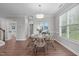 Dining area with seating for four, natural light, and wood flooring at 1024 Holland Bend Dr Dr, Cary, NC 27519