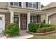 Inviting front porch featuring stone accents and lush landscaping at 1024 Holland Bend Dr Dr, Cary, NC 27519
