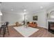 Cozy living room with fireplace, wood flooring, and neutral color palette at 1024 Holland Bend Dr Dr, Cary, NC 27519