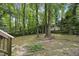 A charming backyard with mature trees provides a relaxing outdoor area at 103 Oxford Cir, Knightdale, NC 27545