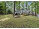An idyllic backyard showcases the rear exterior of the home at 103 Oxford Cir, Knightdale, NC 27545