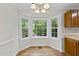 Breakfast nook with hardwood floors and a large bay window overlooking the backyard at 103 Oxford Cir, Knightdale, NC 27545