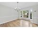 Light-filled dining room featuring hardwood floors, chandelier and large bay window at 103 Oxford Cir, Knightdale, NC 27545