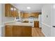 Functional kitchen with hardwood floors, ample cabinets and modern appliances at 103 Oxford Cir, Knightdale, NC 27545