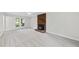 Bright living room featuring a brick fireplace, carpet and a large window at 103 Oxford Cir, Knightdale, NC 27545