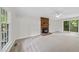 Cozy living room with carpet, brick fireplace, and sliding glass door to patio at 103 Oxford Cir, Knightdale, NC 27545