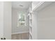 Walk-in closet with shelving and window at 103 Oxford Cir, Knightdale, NC 27545