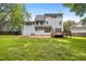 Expansive backyard featuring a spacious deck and lush lawn, perfect for outdoor enjoyment and entertaining at 104 S Crabtree Knl, Chapel Hill, NC 27514