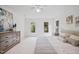 Bright bedroom featuring neutral decor, a ceiling fan, and two windows overlooking trees at 104 S Crabtree Knl, Chapel Hill, NC 27514