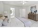 Spacious bedroom with ensuite bathroom, neutral decor and natural light from the windows at 104 S Crabtree Knl, Chapel Hill, NC 27514