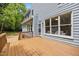 View of home with wood deck and siding, showcasing a beautiful outdoor living space at 104 S Crabtree Knl, Chapel Hill, NC 27514